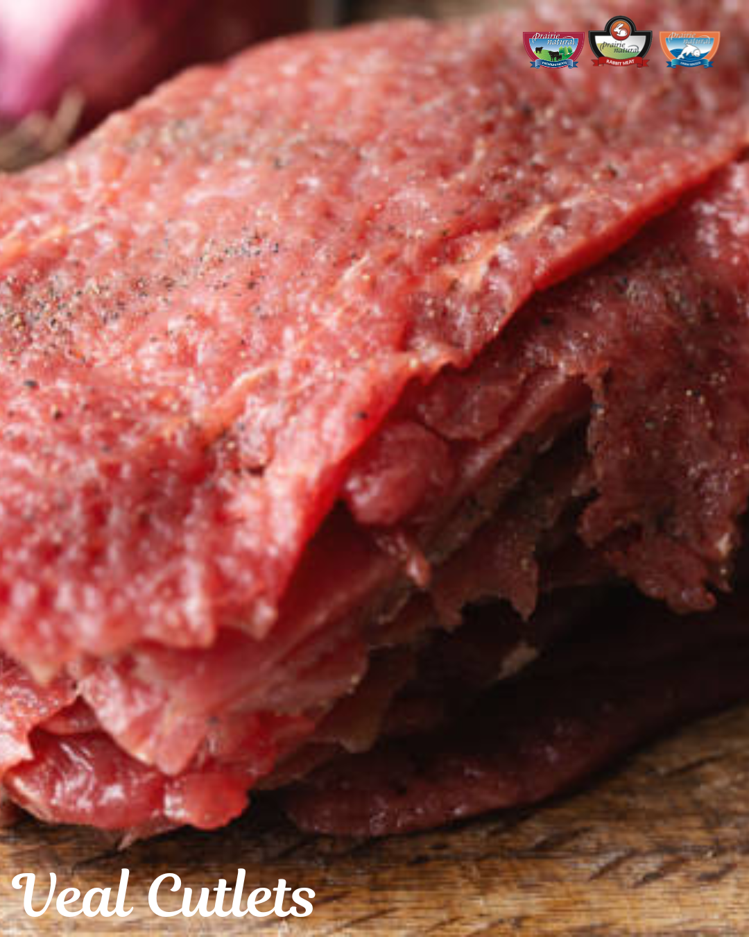 Stack of thin, raw veal cutlets with visible grain and seasoning.