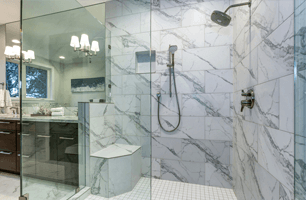 Frameless shower enclosure