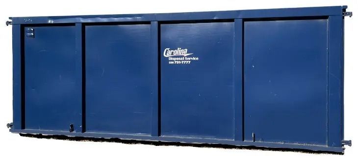 A blue dumpster is sitting on a white surface.
