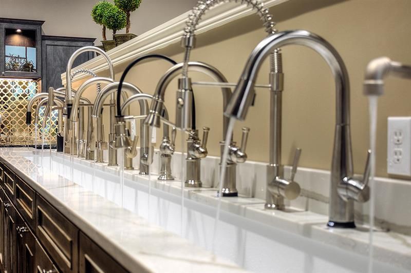 A row of kitchen faucets