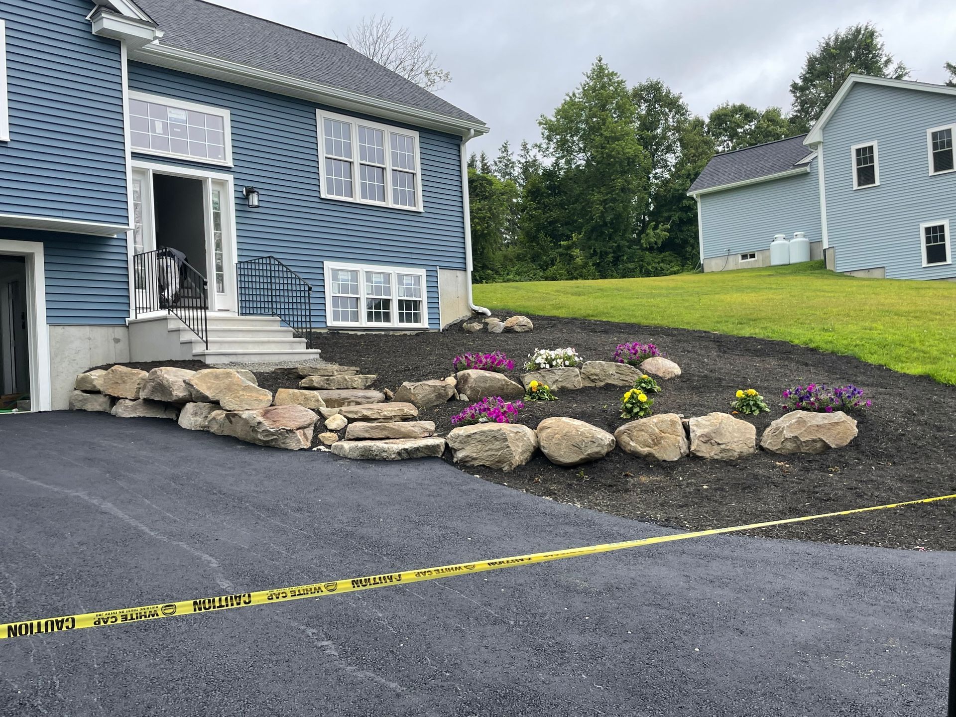 A house with a lot of rocks in front of it