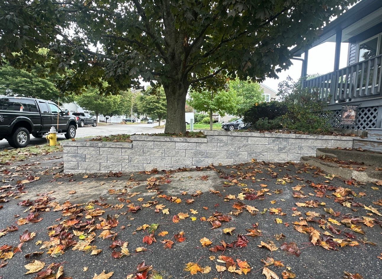 A fire hydrant is in the middle of a parking lot