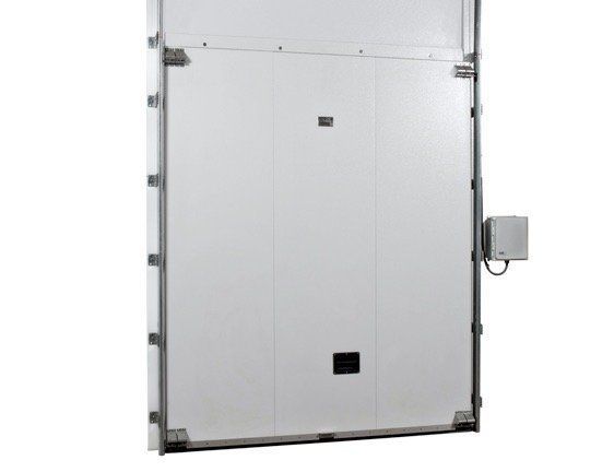 Large white insulated door in a commercial or industrial setting.