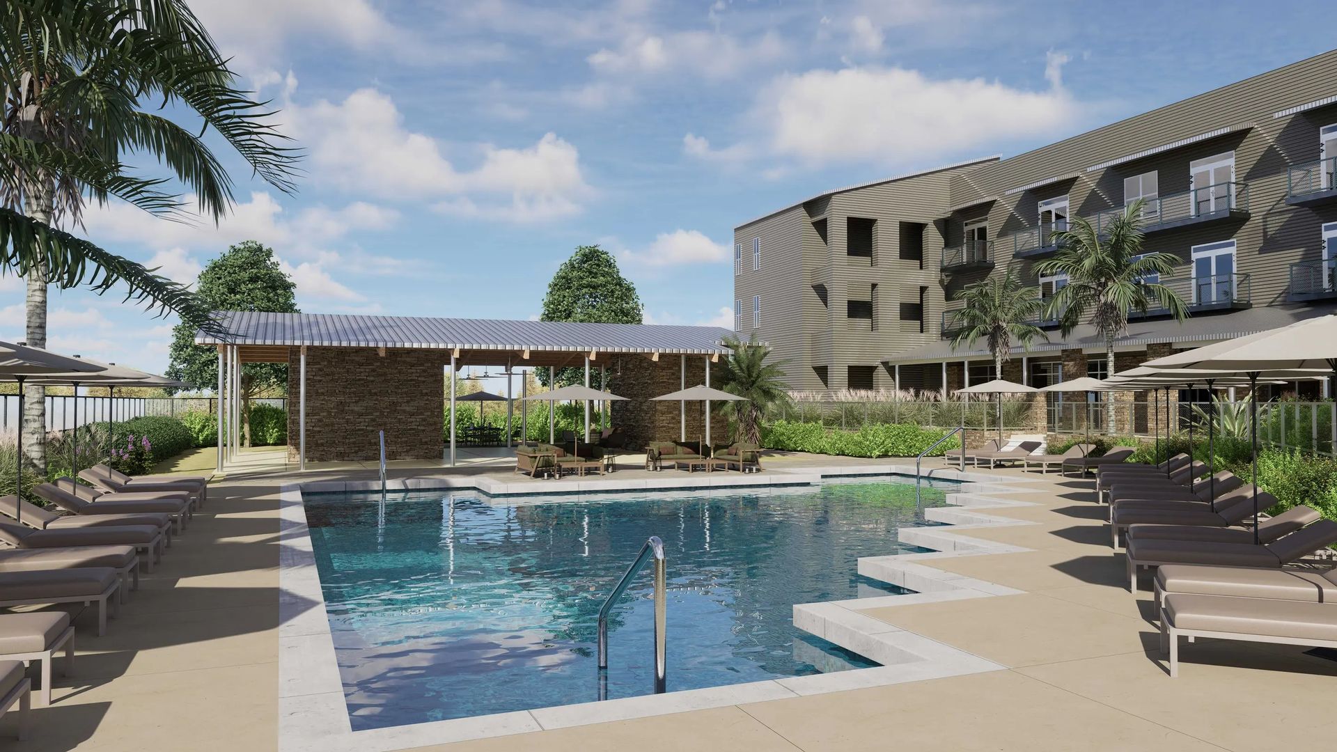Modern hotel pool courtyard with lounge chairs, cabana, and a building under a blue sky