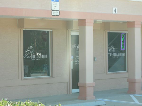 Exterior of a storefront with windows, an 