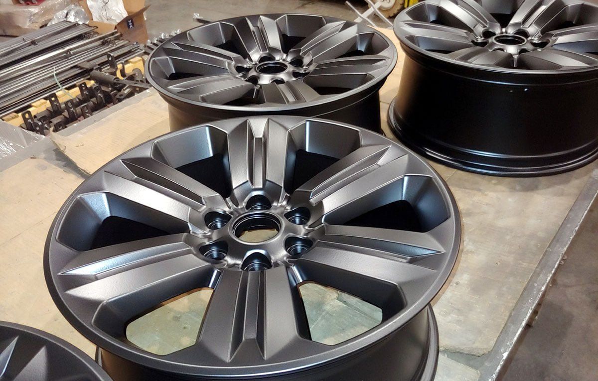 Powder coating for vehicle parts