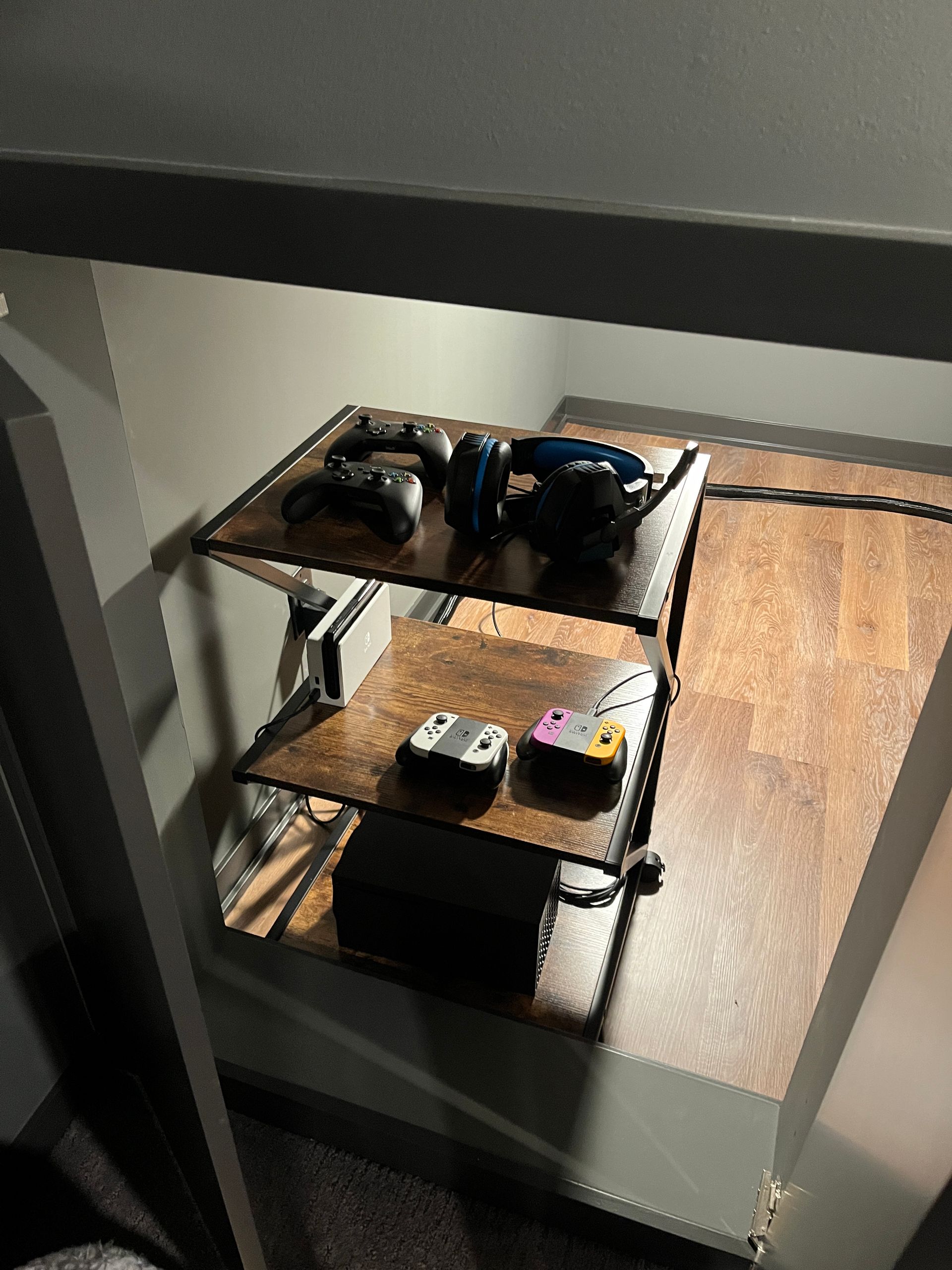 A wooden shelf with a bunch of items on it