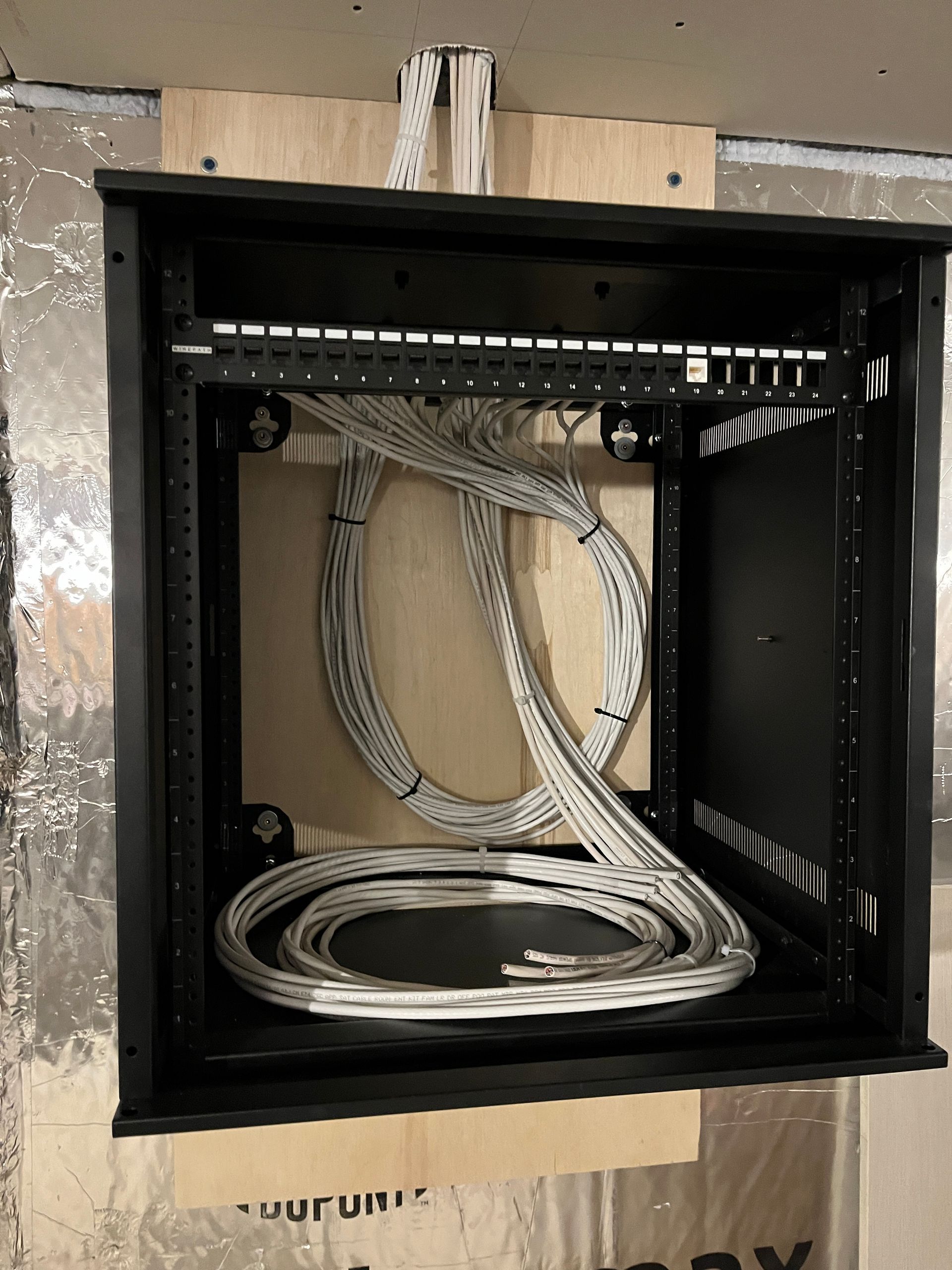 A black box with a bunch of wires inside of it