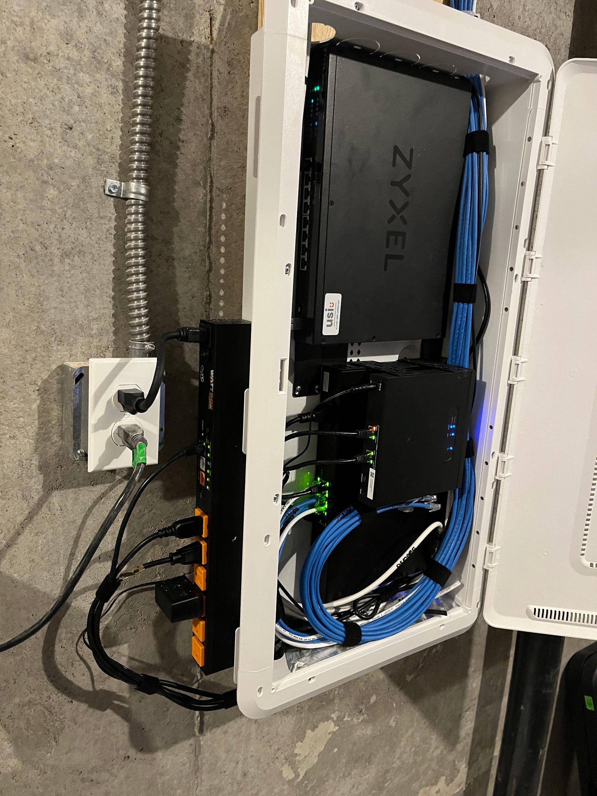 A white box with a zyxel router inside of it.