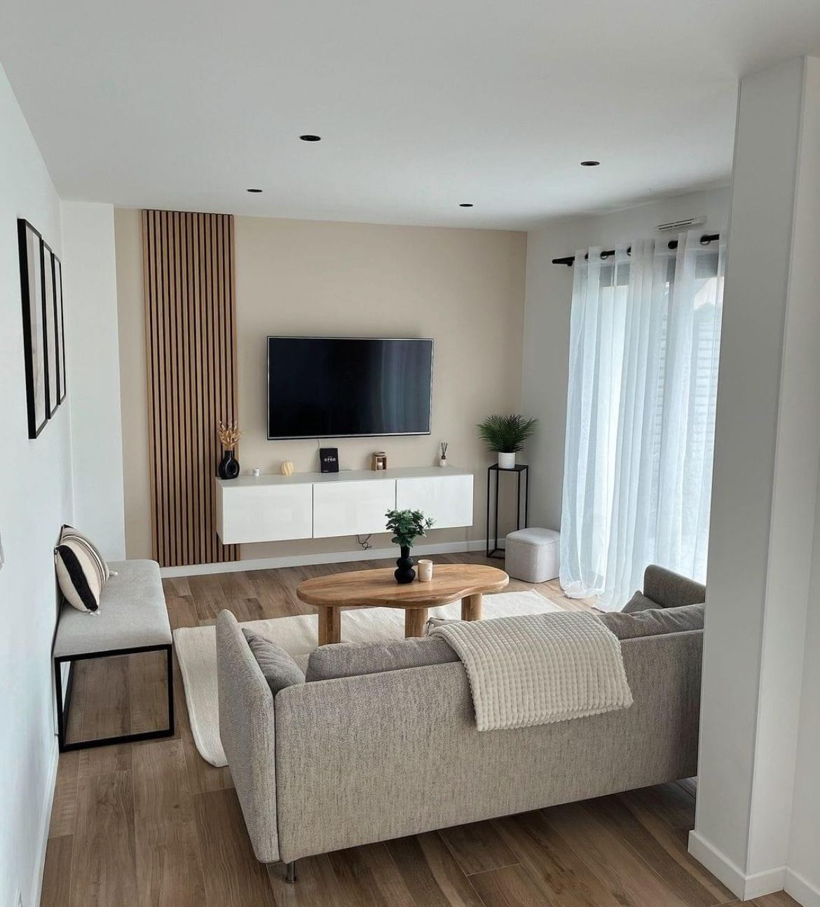 A living room with a couch , table and television