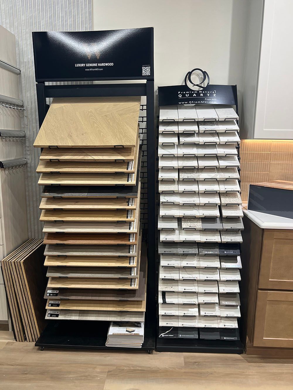 Black display shelves with stacked beige and white paper trays in a store or office.