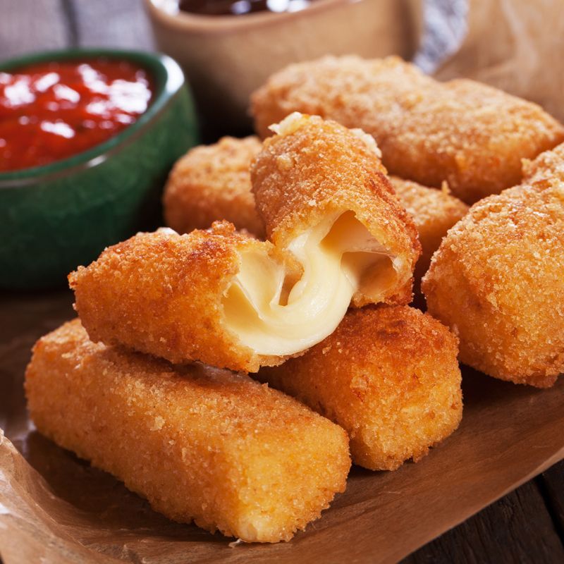 Fried cheese sticks with a bite taken out of one
