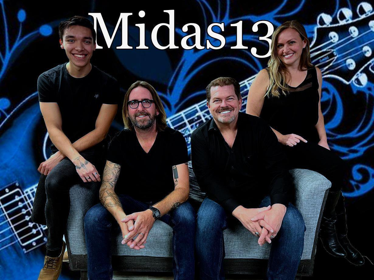 A band called midas13 is posing for a picture