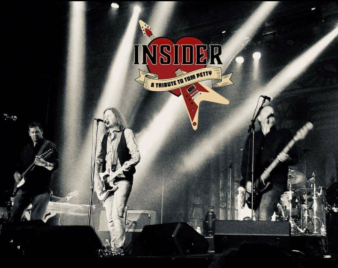 A black and white photo of a band called insider