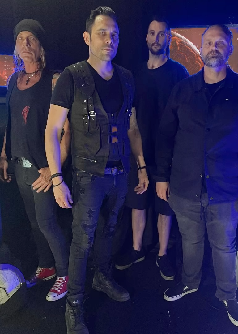 A group of men standing next to each other in a dark room