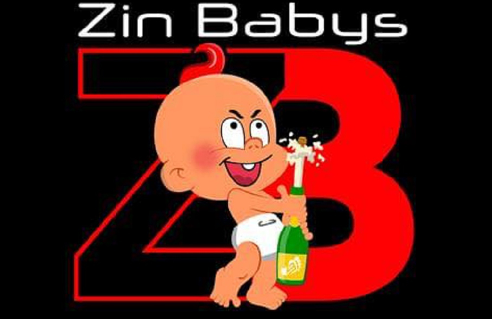 A cartoon baby in a diaper is holding a bottle of champagne.