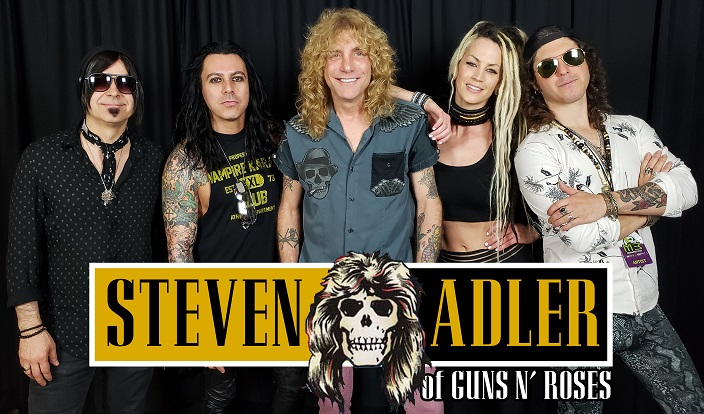 A group of people standing in front of a sign that says steven adler