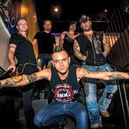 A group of men are posing for a picture on a set of stairs.