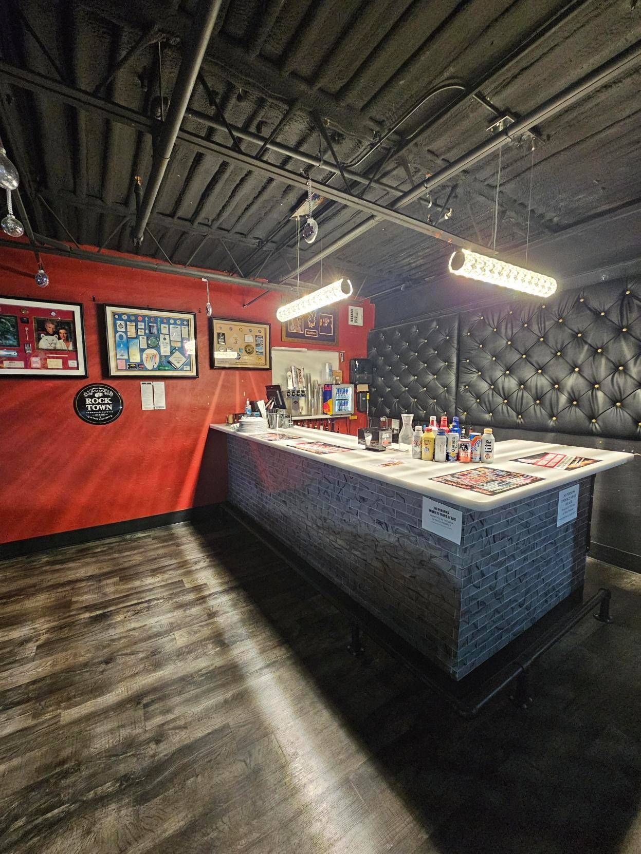 There is a long bar in the middle of the room.