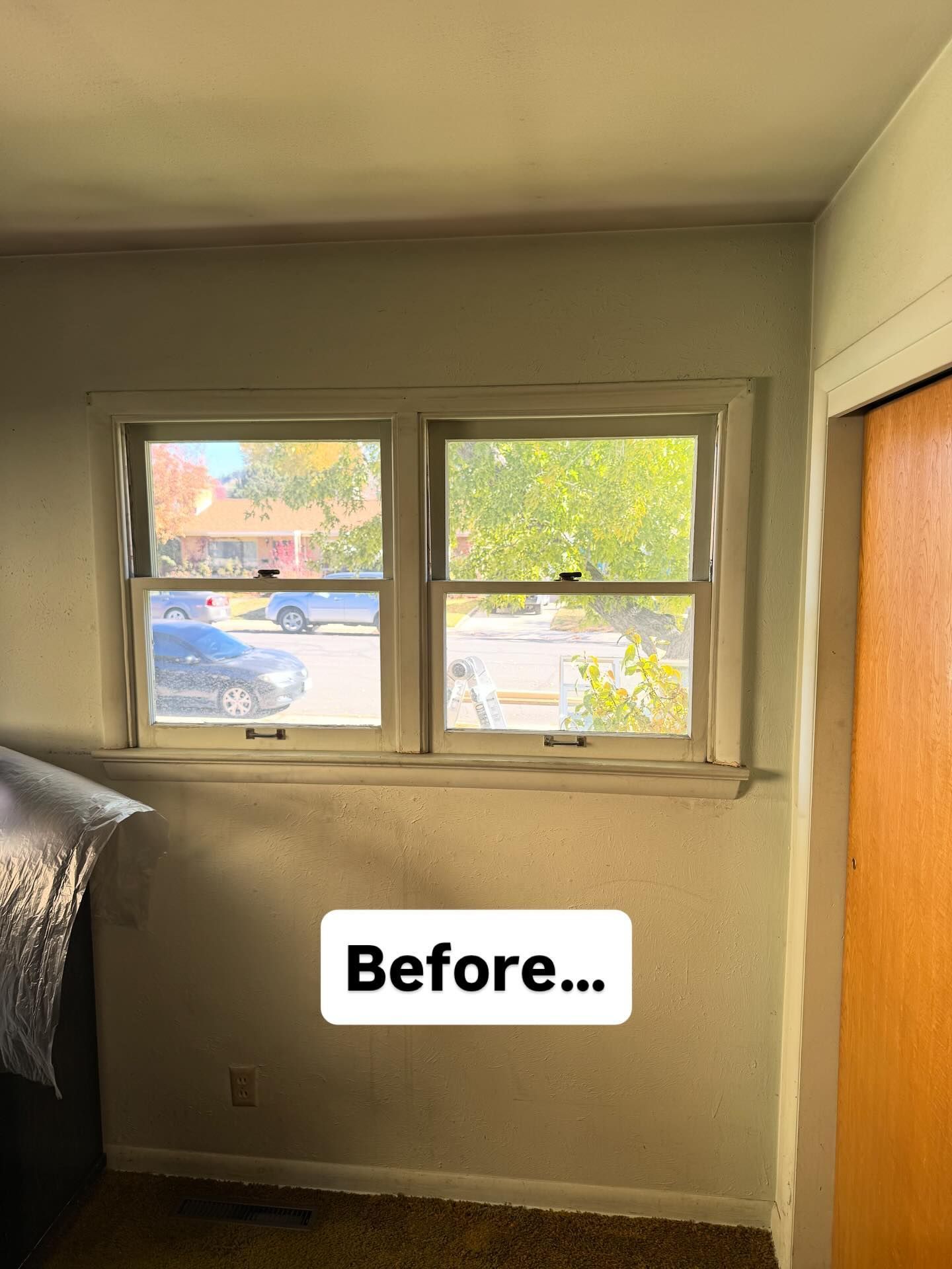 Two-pane window in a room with peeling paint