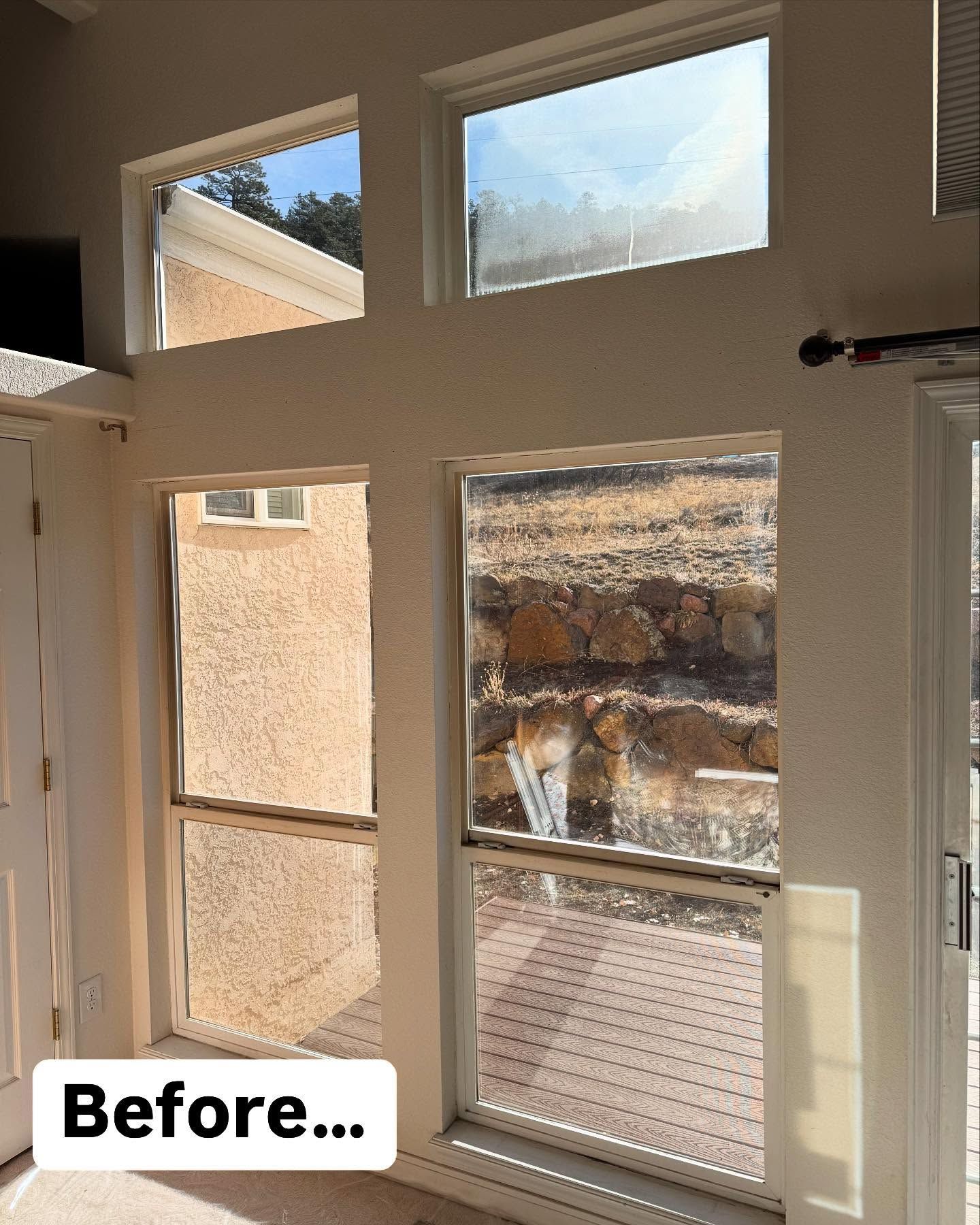 A room with a lot of windows and a sign that says before