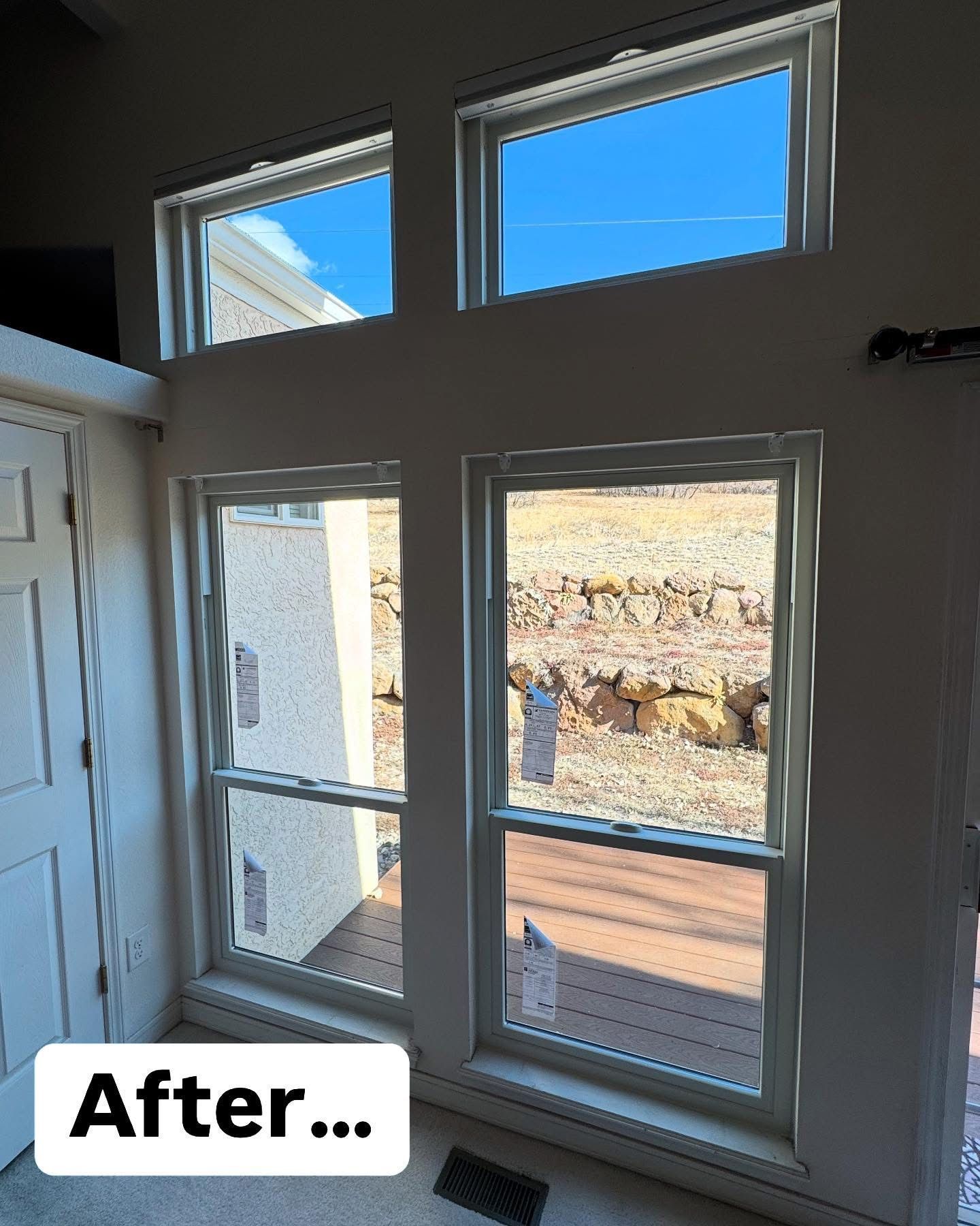 A room with a lot of windows and a sign that says after.