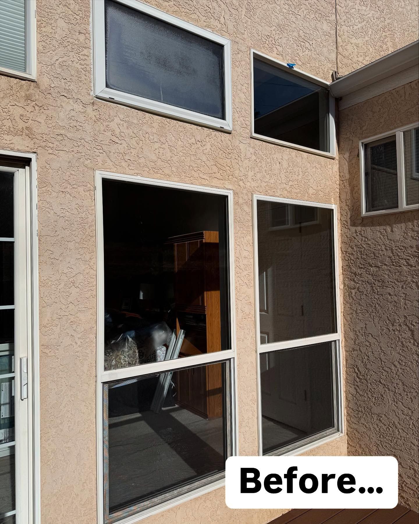 A before picture of a house with a lot of windows