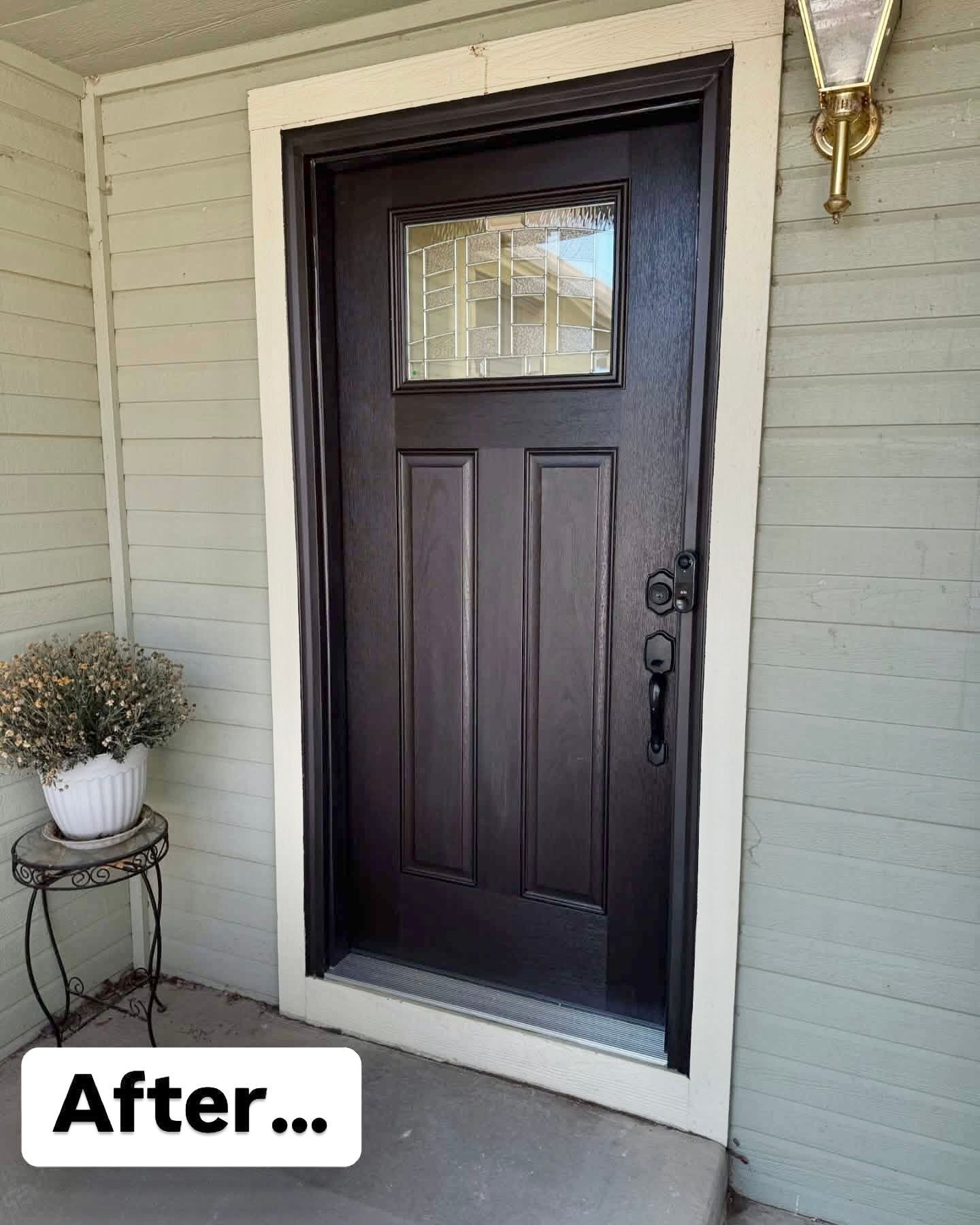 A picture of a door that has been painted black.