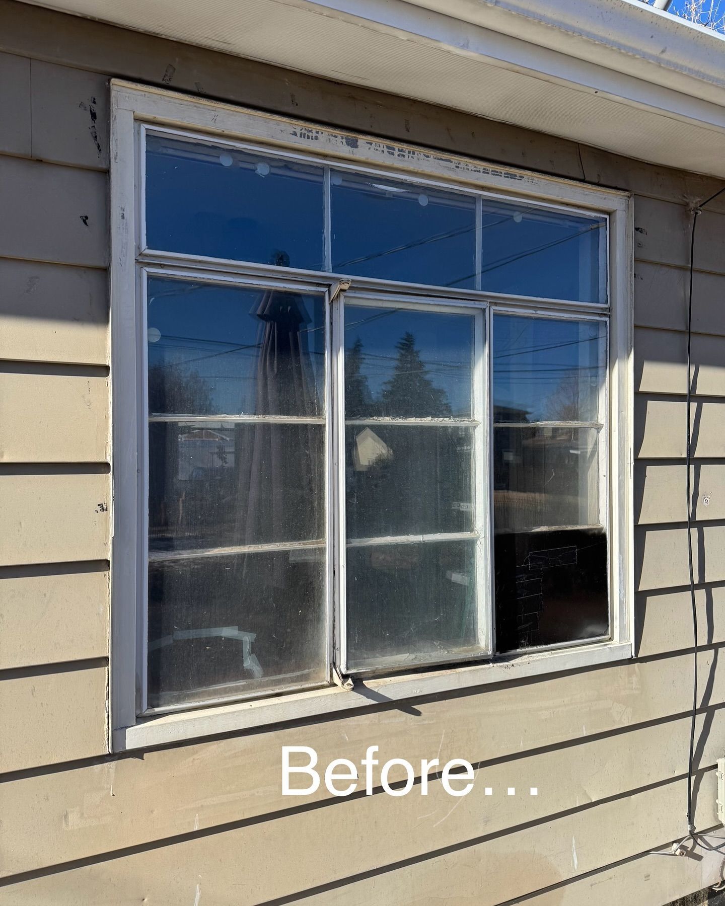 A before picture of a window on a house.