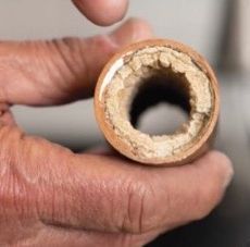 Copper pipe with calcium buildup