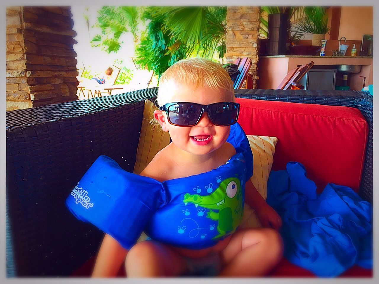 Baby wearing pool float