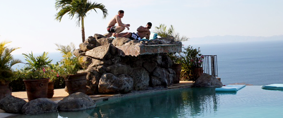 Men enjoying by pool side