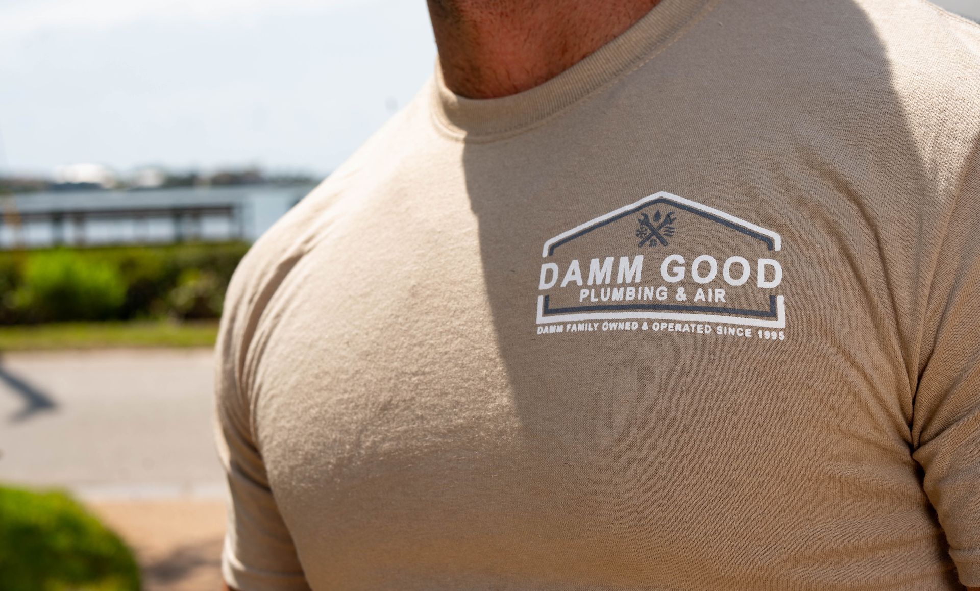 Man wearing a tan shirt with 