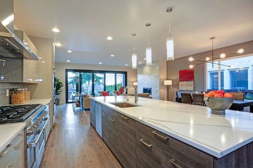 A kitchen with a large island in the middle of the room.