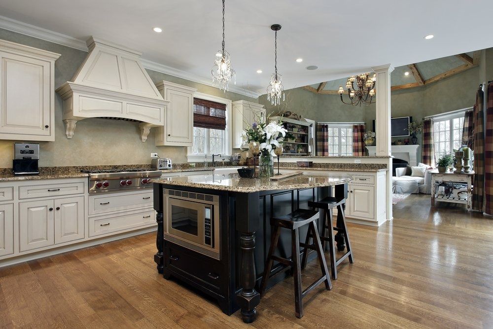 A kitchen with a large island in the middle of it.