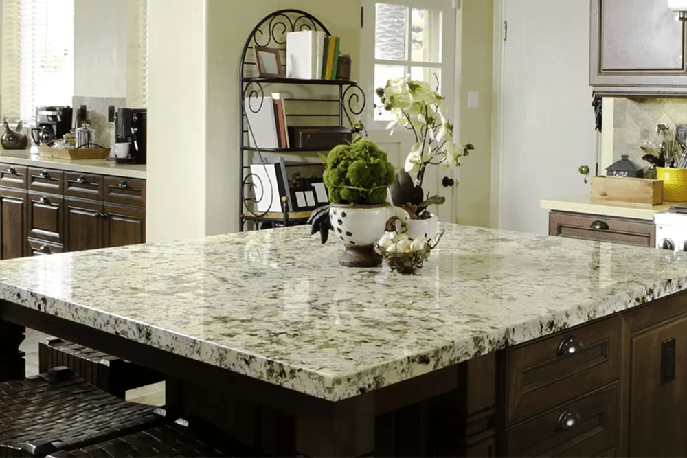 A kitchen with a large granite counter top and wooden cabinets.