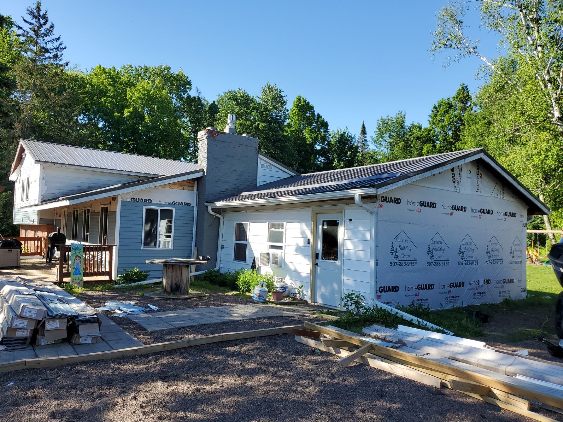 A house is being built in the middle of a forest.
