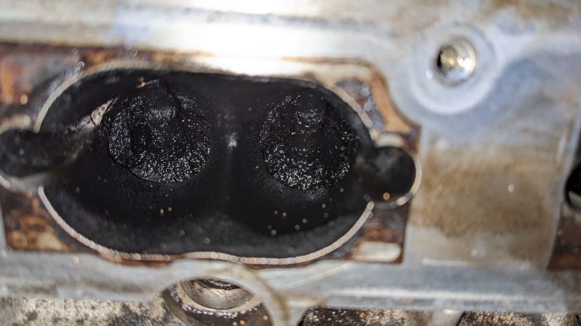 A close up of a piece of metal with a hole in it