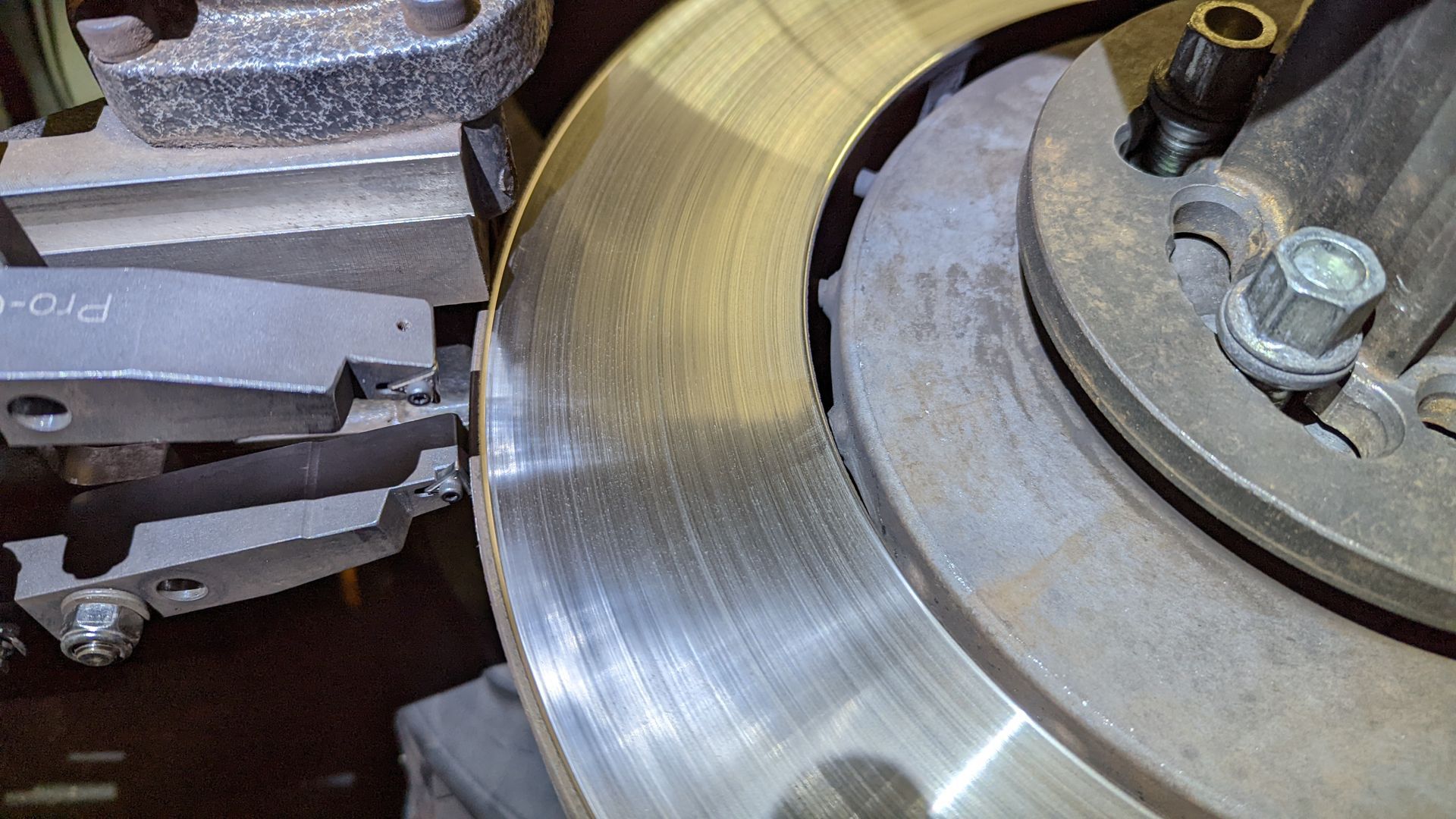 A close up of a brake disc on a machine.