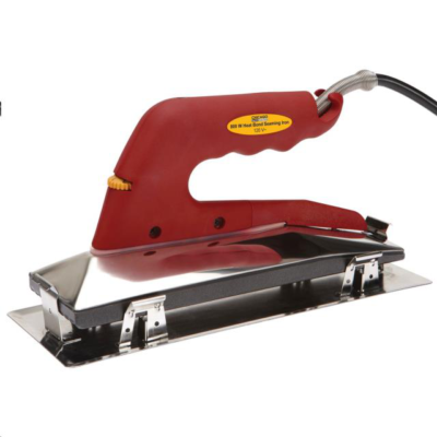 A red hand-held heat seaming iron with a metallic base plate for carpet installation.