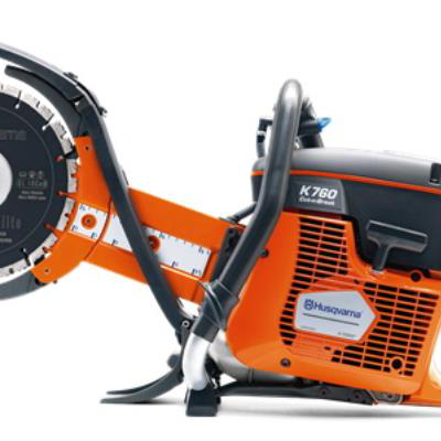 A Husqvarna K760 orange and black gas-powered concrete saw with a circular cutting blade on a white background.