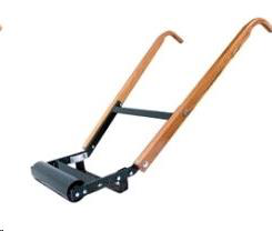 A manual floor roller with wooden handles and a black metal frame and roller head, set against a plain white background.