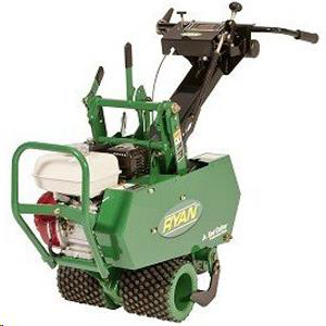 A green Ryan Jr. Sod Cutter with a white gas engine, featuring textured drive wheels and a handle for manual operation.