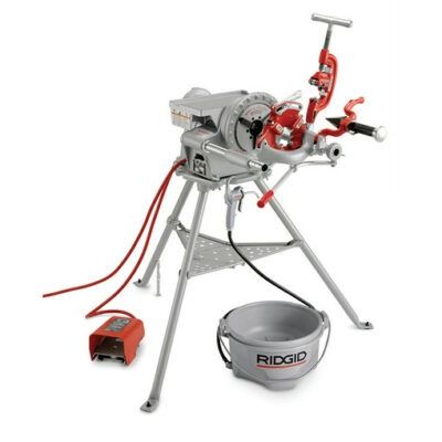 A powered pipe threading machine on a tripod stand, with a foot pedal and bucket.