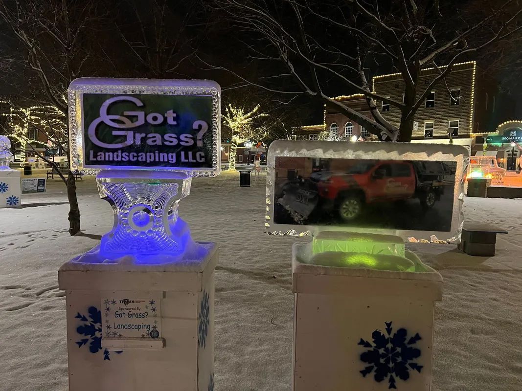 Two ice sculptures: one with a logo 