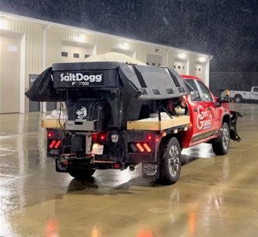 A red pickup truck with a large black 