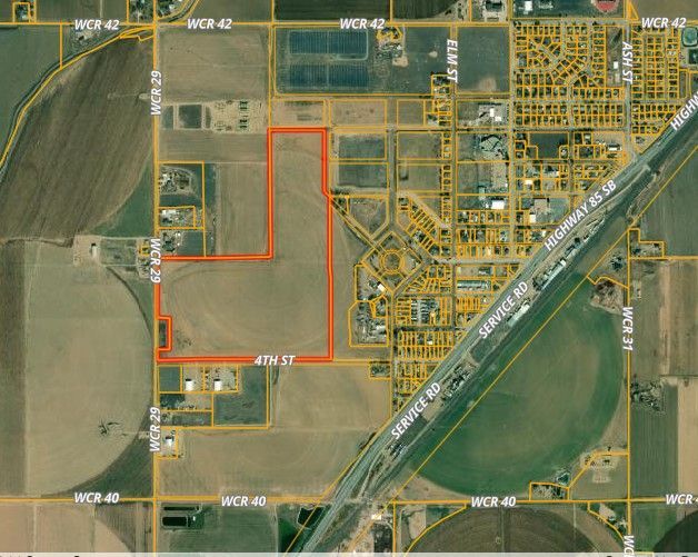 An aerial view of a city with a red circle in the middle