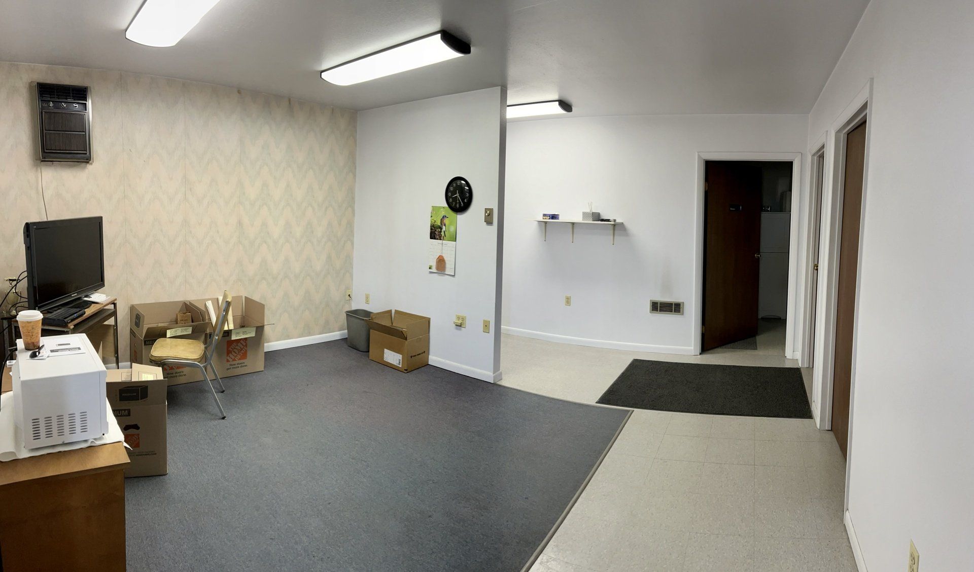 A large room with a lot of boxes on the floor