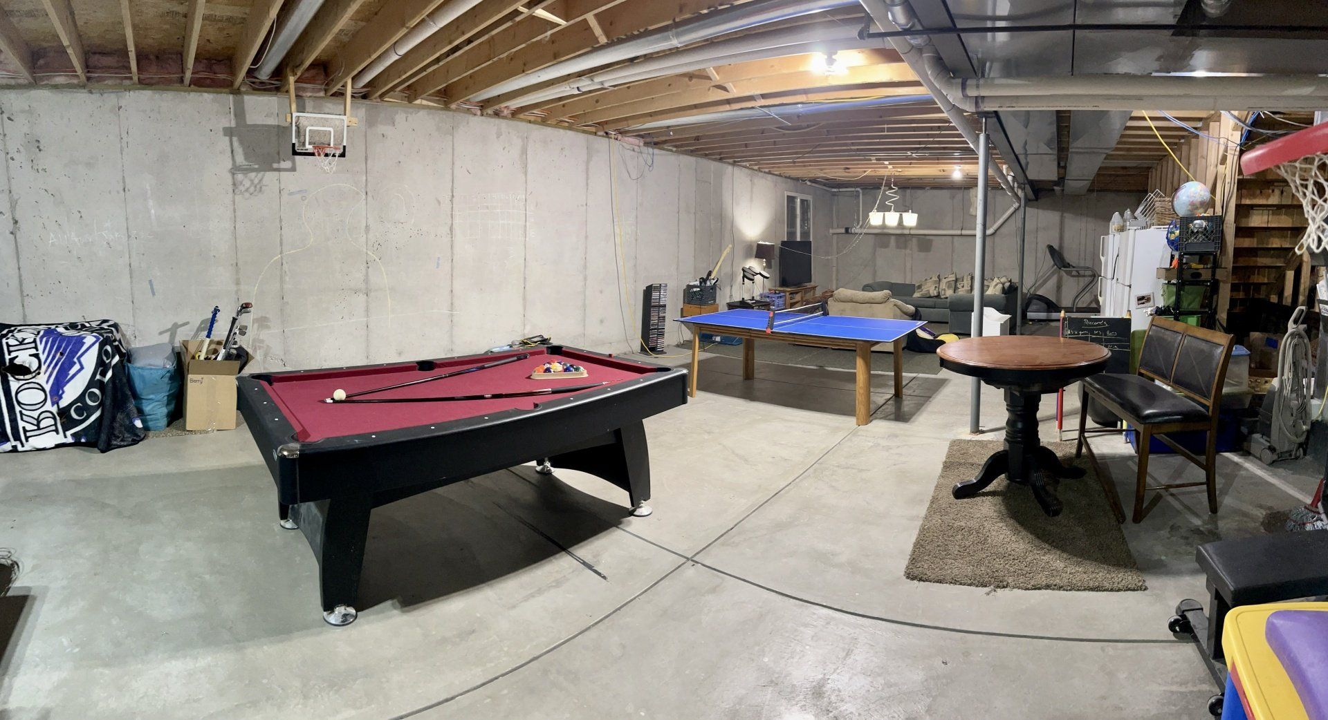 There is a pool table in the middle of the room.