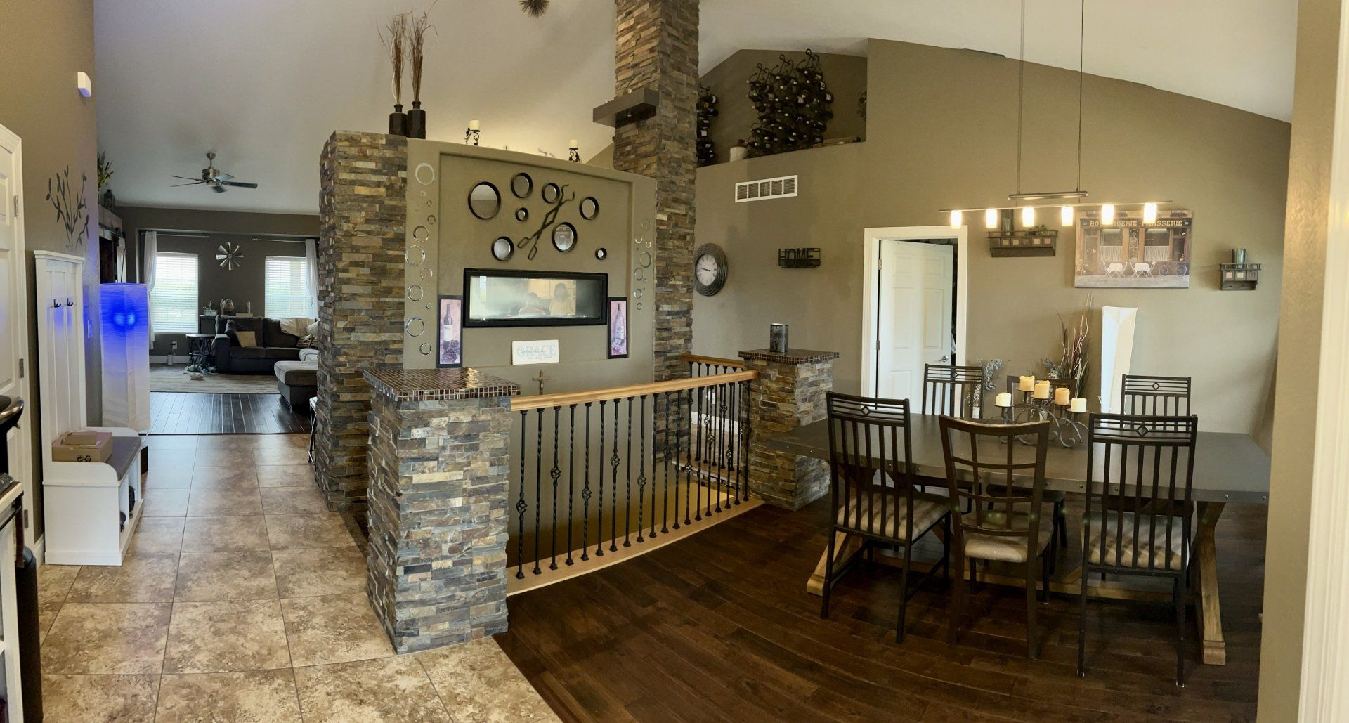 There is a dining room table and chairs in the middle of the room.